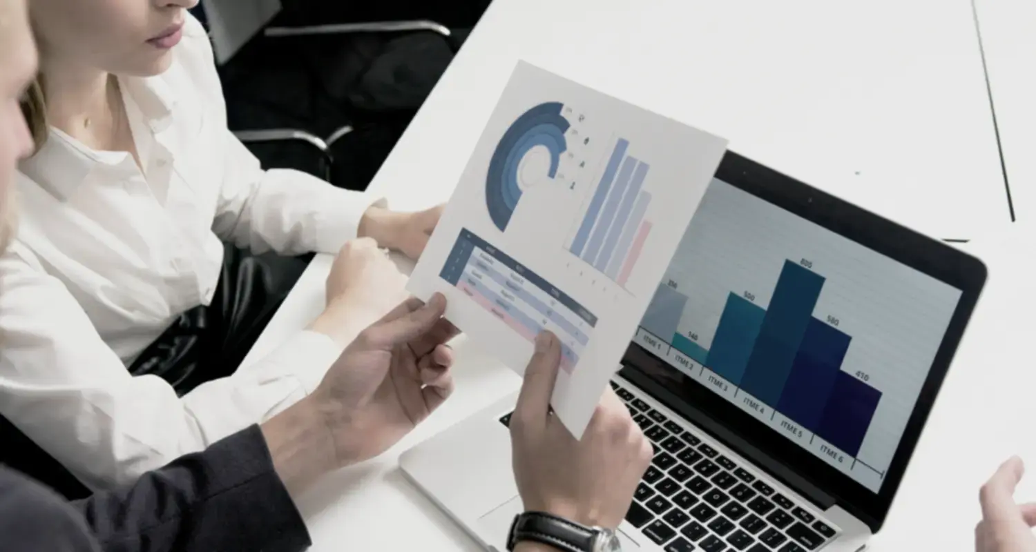 two people analyzing a report